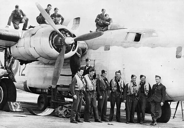 A Czech aircrew stand by their Liberator while the ground crew check it over