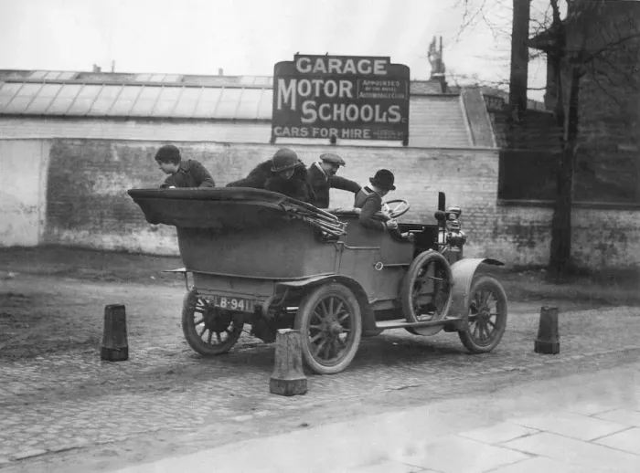 Framed Print : Daily Mirror Man v Woman Motor Test February 1914 A lady reverses a car through Framed Print : Daily Mirror Man v Woman Motor Test February 1914 A lady reverses a car through