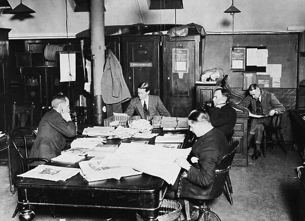 Daily Mirror News Room in Bouverie Street circa 1920. Left to Right William Rider