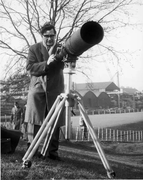 Framed Print : Daily Mirror Photographer Charles Ley seen here with a telephoto lens attached to his Framed Print : Daily Mirror Photographer Charles Ley seen here with a telephoto lens attached to his