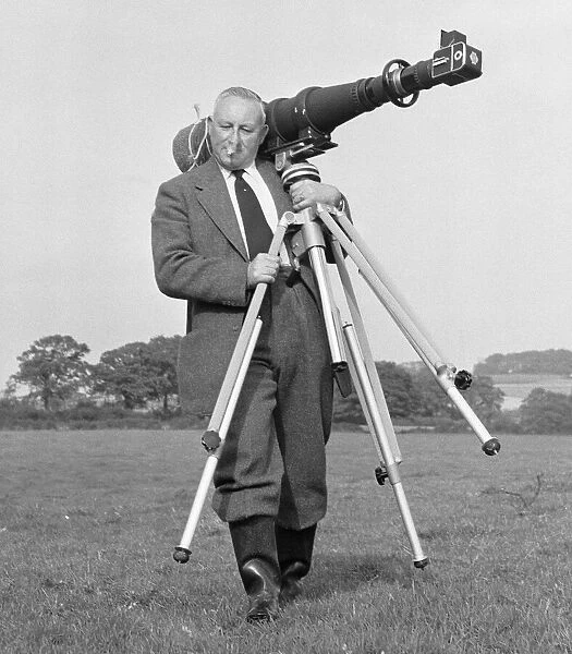 Daily Mirror photographer George Greenwell seen here with his Hasselblad 500 camera