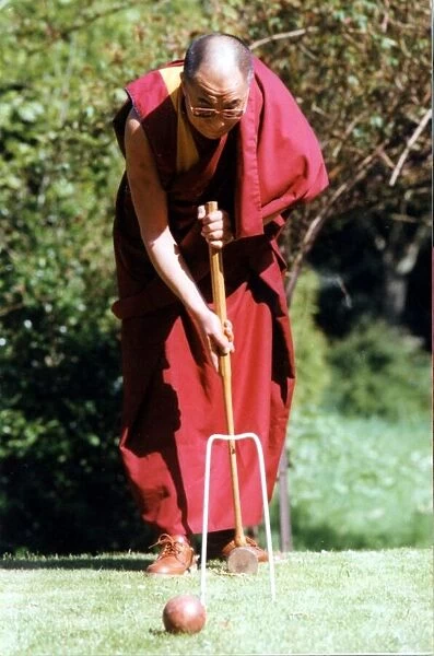 The Dalai Lama, the Tibetan spirtual leader pictured playing croquet at the Egerton Grey