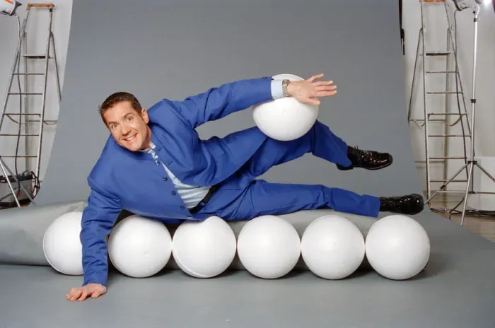 Framed Print : Dale Winton, TV presenter, poses for a studio photoshoot to celebrate his hosting of
