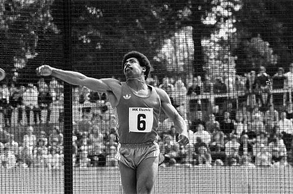 Daley Thompson puts everything into his discus throw on his way to winning