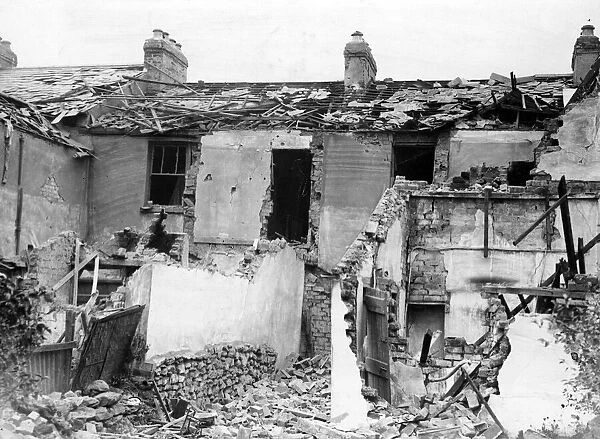 Damage to a house property caused by a bomb which fell in a Welsh town. Circa 1941