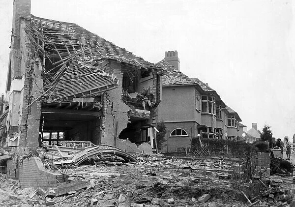 Damage done to a street in the suburbs of Cardiff. Circa 1941