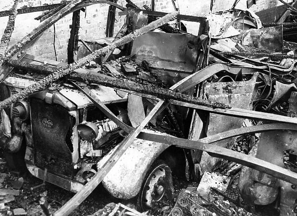 A damaged Albion motor car in South Wales following an attack by Nazi raiders. Circa 1941