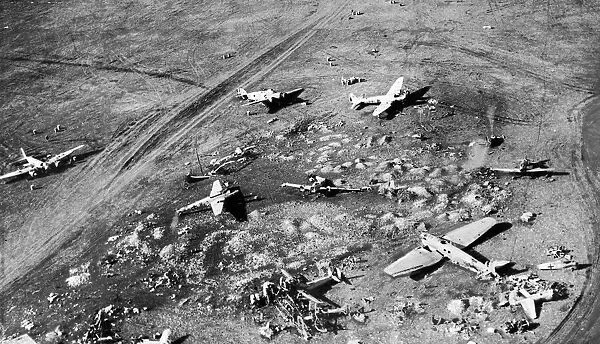 Damaged enemy aircraft and workshops at derna Aerodrome