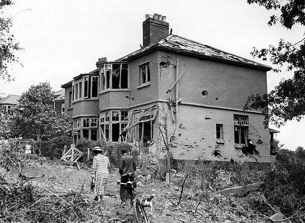 Damaged property in a South Wales town caused by a bomb. Circa 1941
