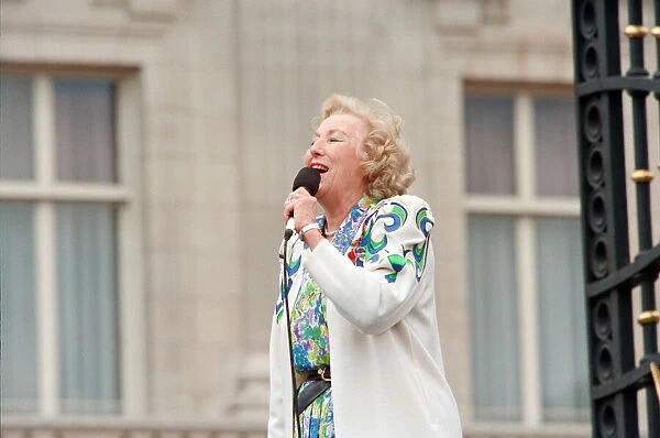 Dame Vera Lynn singing for the crowds gathered at Buckingham Palace for World War II VE