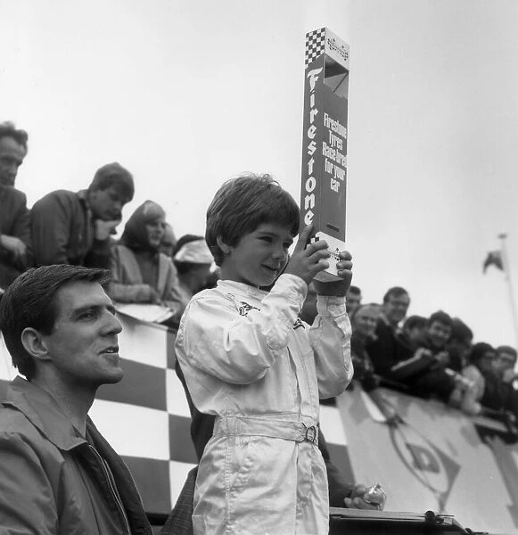 DAMON HILL, AGED SIX WATCHES HIS FATHER GRAHAM HILL RACE AT SILVERSTONE