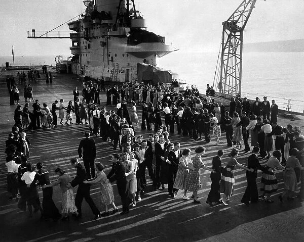 Dance on board H. M. S. Victorious. They are dancing on the deck of the aircraft-carrier H