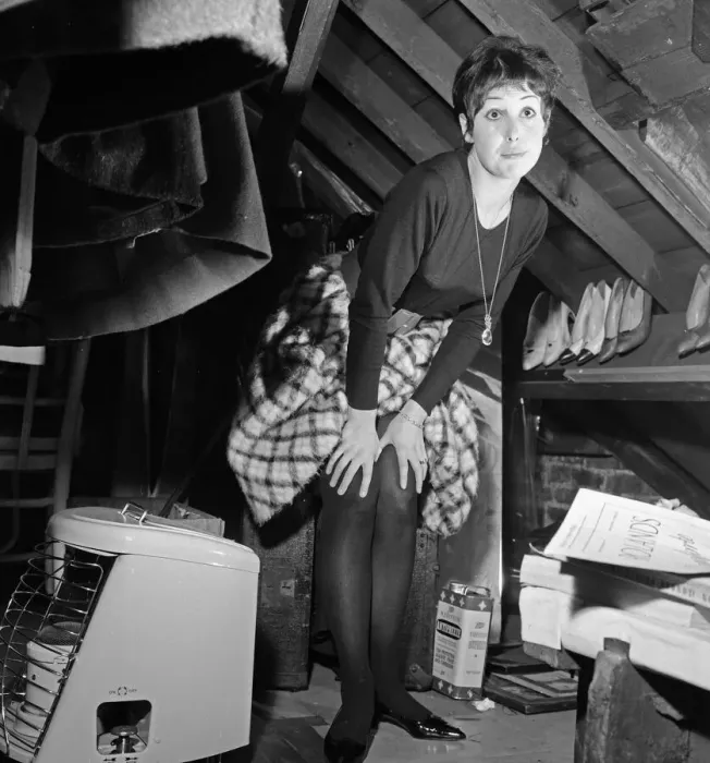 Framed Print : Dancer Una Stubbs, aged 22, in her flat in London. Inside the attic cupboard about to Framed Print : Dancer Una Stubbs, aged 22, in her flat in London. Inside the attic cupboard about to