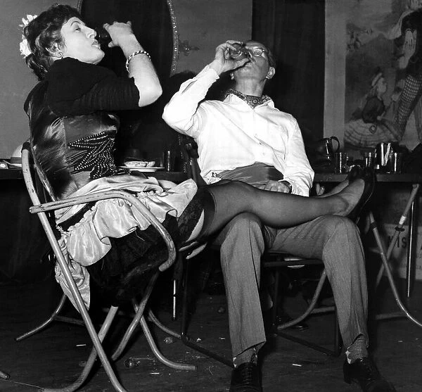 Two dancers take time out for a drink - Feet up relaxing 18  /  01  /  1959