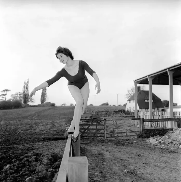 Framed Print : Dancing on the farm Ballerina Gillian Brodie seen here performing on fence posts Framed Print : Dancing on the farm Ballerina Gillian Brodie seen here performing on fence posts