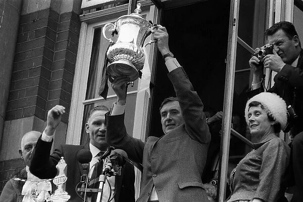 Danny Blanchflower lifts the FA Cup at Town Hall May 1962 watched by manager Bill