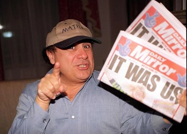 Danny DeVito Actor holding the Daily Mirror Newspaper