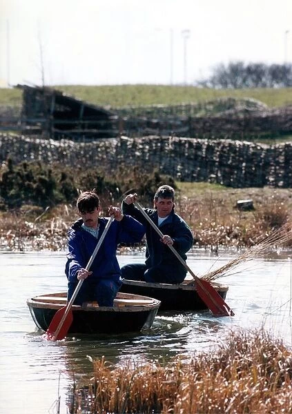 Danny Gilchrist and Dave Potts on the pond at Bedes World in Jarrow with their coracles