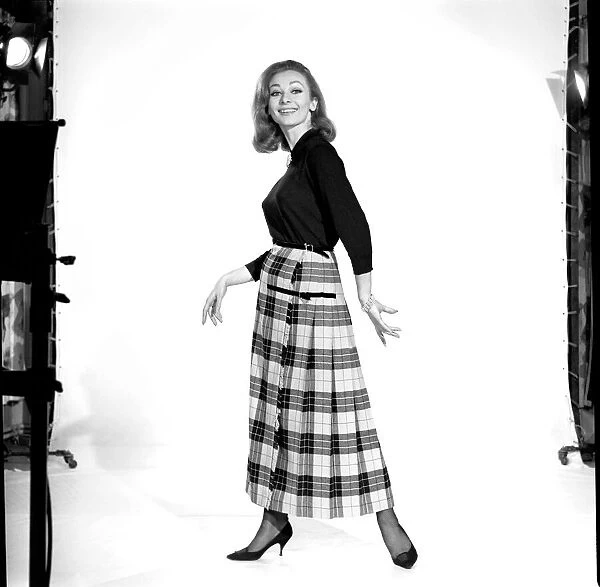 Danny Rendell modelling tartan skirt. 1963 B1853-001