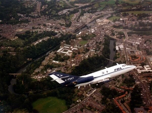A Dassault Falcon 20 aircraft over Durham Cathedral and city
