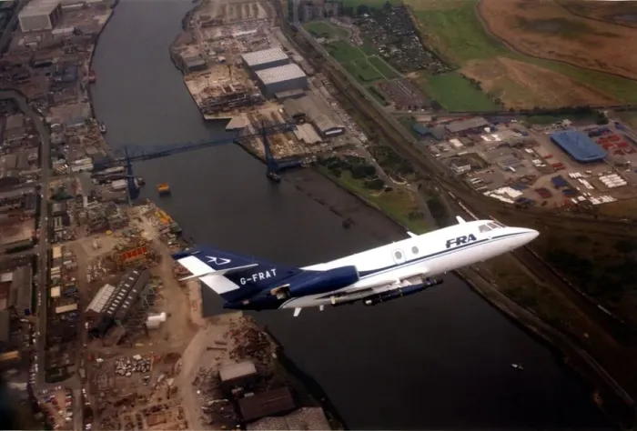 Framed Print : A Dassault Falcon 20 aircraft over the River Tees and the Transporter Bridge in Framed Print : A Dassault Falcon 20 aircraft over the River Tees and the Transporter Bridge in