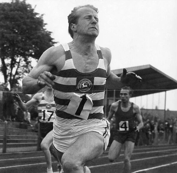 Dave Jones seen winning the 100 yards senior final in 9. 8 seconds a new county record