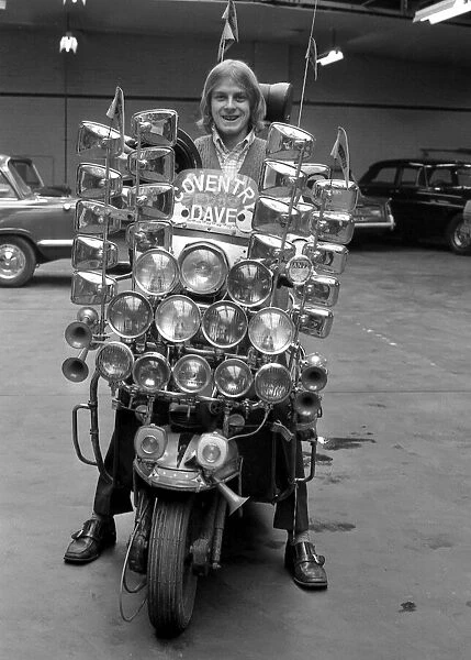 Dave Lewis(17), of Coventry sits on his very distinctive scooter which has 12 headlamps
