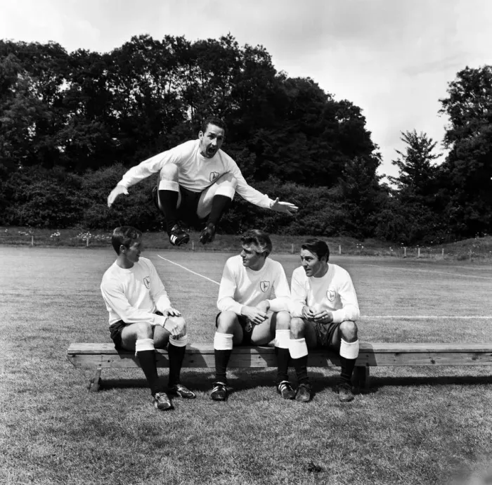 Framed Print : Dave Mackay of Tottenham Hotpurs jumps into the new 1965 / 66 season over teammates Cliff Framed Print : Dave Mackay of Tottenham Hotpurs jumps into the new 1965 / 66 season over teammates Cliff