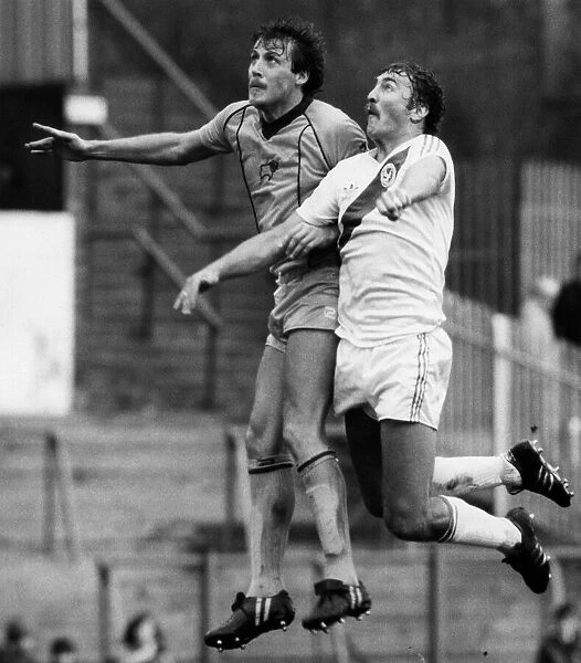 Dave Swindlehurst of Derby jumps up with Jim Cannon of Crystal Palace during their match