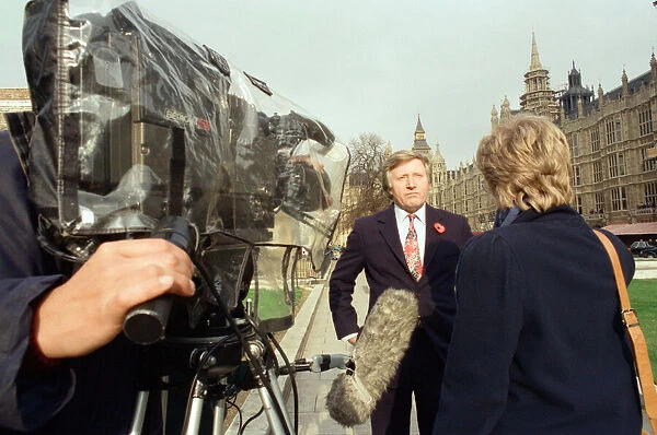 David Dimbleby, journalist and television presenter pictured during some outdoor filming