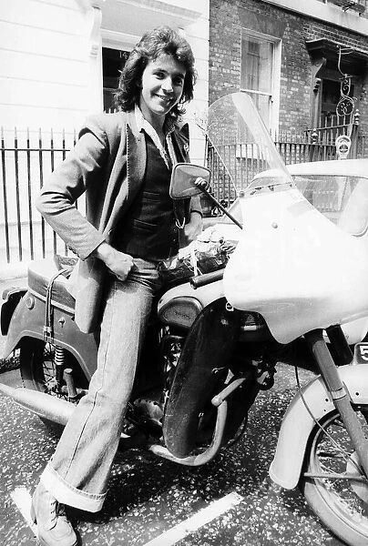 David Essex - July 1975 Singer Actor sitting on an old Triumph Motorcycle