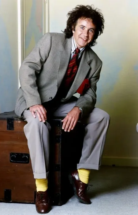 Framed Print : David Essex Singer sitting on a blanket box wearing a suit and yellow socks Framed Print : David Essex Singer sitting on a blanket box wearing a suit and yellow socks