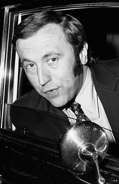 David Frost driving away from his London Home in his Bentley after splitting up with his