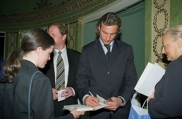 David Ginola footballer signs autographs for his fans May 1999 at the Dorchester
