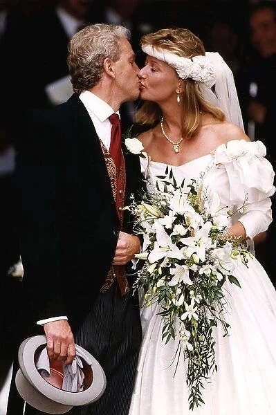 David Gower former cricket player kisses his new bride Thorrun Nash on the lips at their