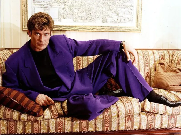 Framed Print : David Hasselhoff actor singer reclining on settee wearing purple suit