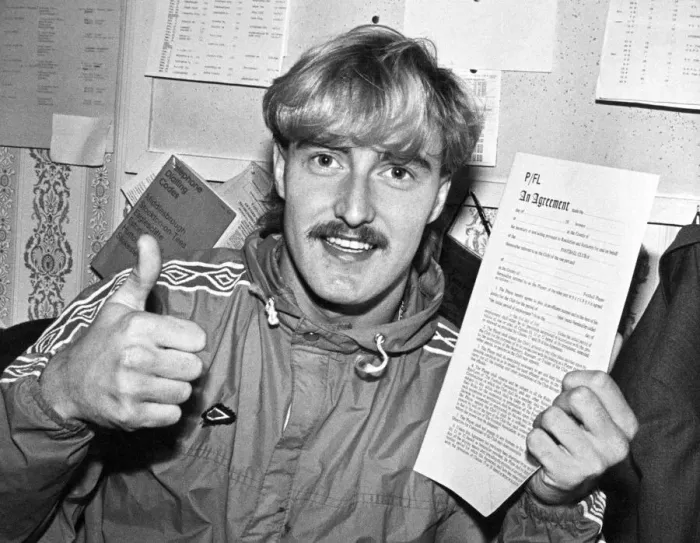 Framed Print : David Hodgson holding up a contract, giving a thumbs up sign, circa 1980s