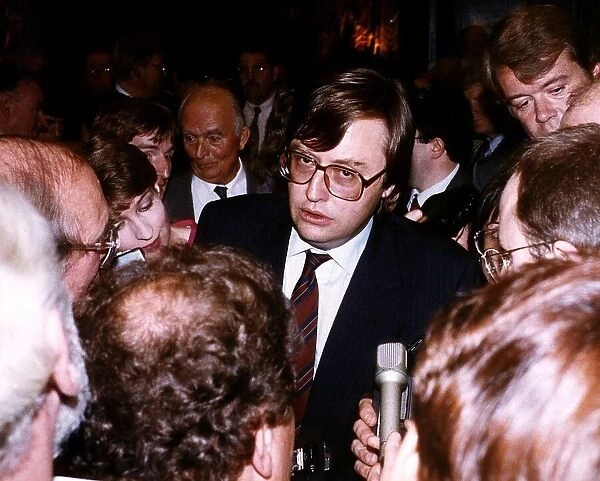 David Mellor Conservative Member of Parliament surrounded by journalists at the Press