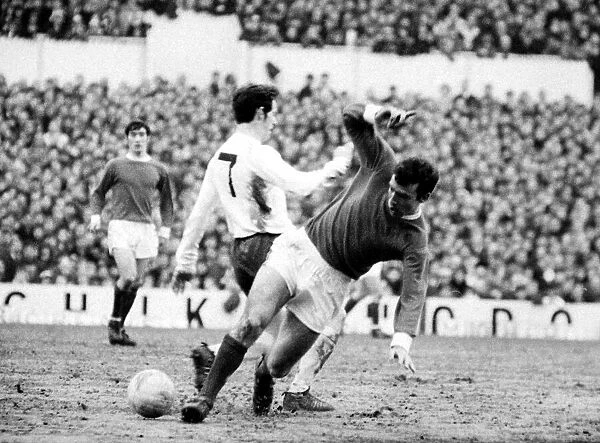David Sadler of Manchester United takes the ball away from Robertson of Tottenham Hotspur