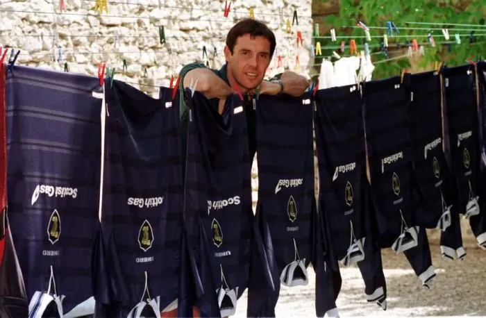 Framed Print : David Weir posing beside a washing line holding Scotland tops during the World Cup