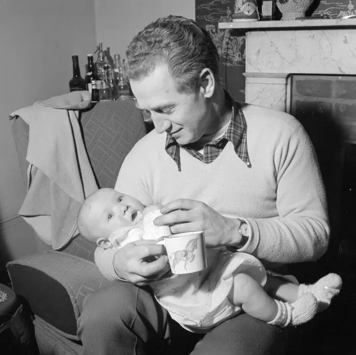 Framed Print : David Williams feeding one of his twins January 1957 Framed Print : David Williams feeding one of his twins January 1957