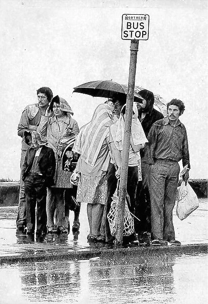 These day trippers to Seaburn were caught in a sudden downpour in 1973