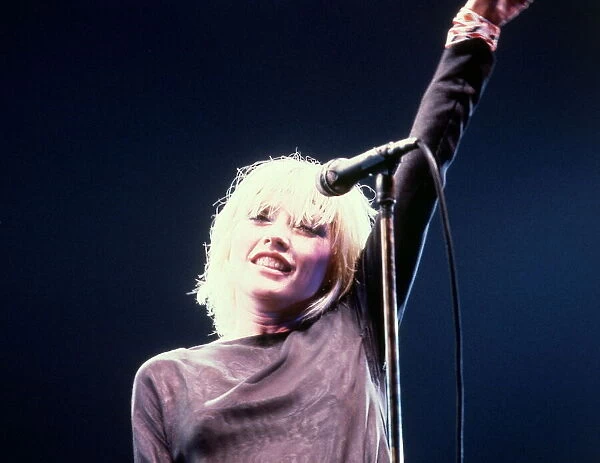 Debbie Harry on stage in 1980 singing performing concert microphone