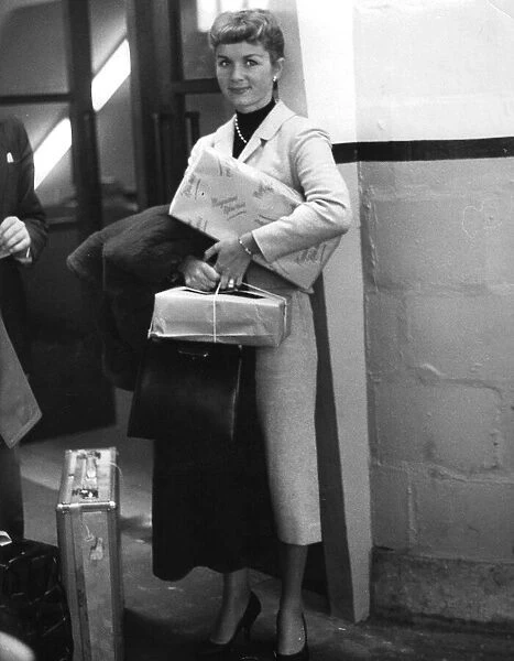 Debbie Reynolds carrying parcels - 5 June 1957