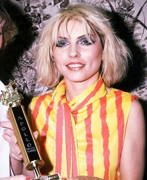 Deborah Harry of the pop group Blondie holding Apollo Theatre Glasgow trophy