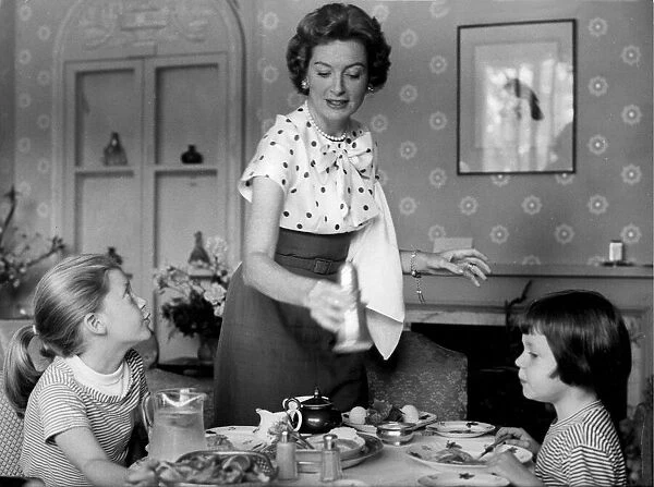 Deborah Kerr giving her daughters lunch in their hotel in London - June 1957