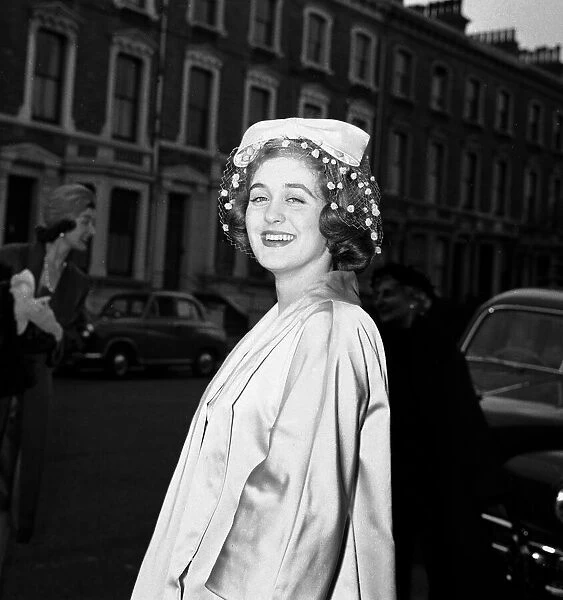 The last debs. Miss Georgina M-D Scott seen here arriving at Buckingham Palace to be