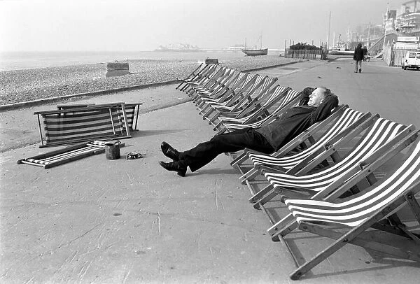 Deck chair tester Ernie Snelling. Its hard work down at the seaside doing the deck chair