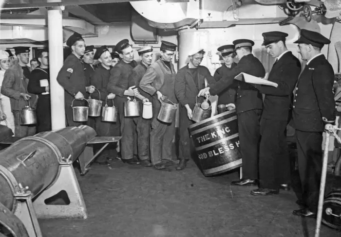 Framed Print : Below deck of HMS George V, a line of seamen queue to collect the daily rum ration for Framed Print : Below deck of HMS George V, a line of seamen queue to collect the daily rum ration for
