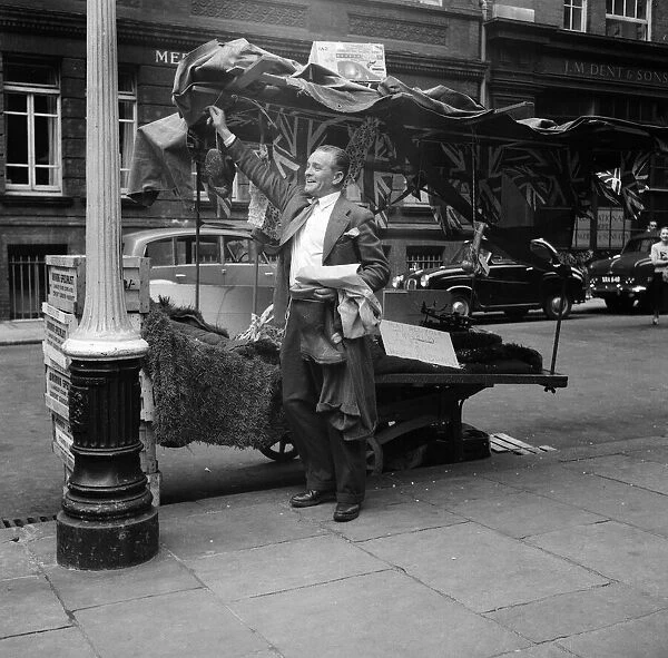 A decorated barrow boys stall on the eve of his wedding, outside Charing Cross Station